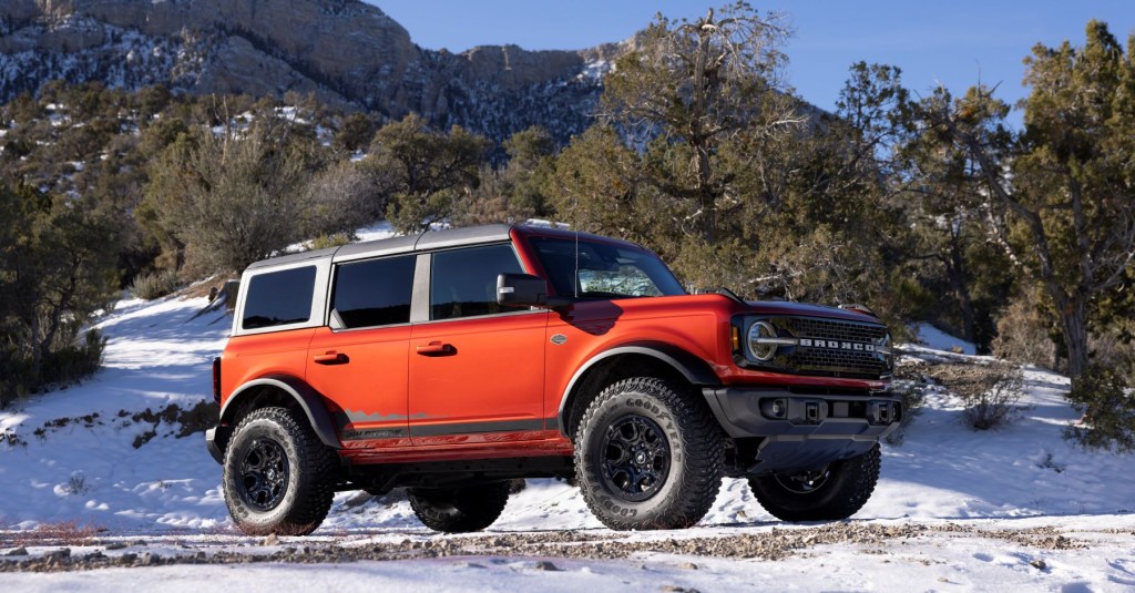A red 2022 Ford Bronco Wildtrak Raptor off-road SUV will have 15 mpg combined. Is lousy fuel economy and a high price outweighed by the performance?