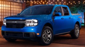 A blue 2022 Ford Maverick small pickup truck is parked outside.