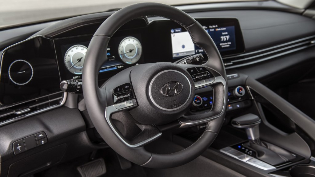 the modern steering wheel and two advanced displays found in the new 2022 hyundai elantra limited 