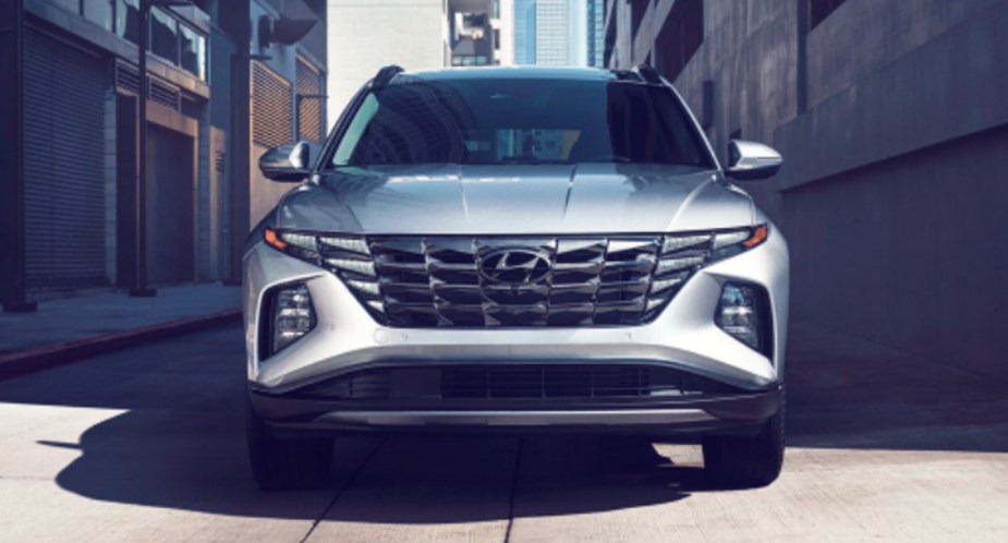 A gray 2022 Hyundai Tucson small SUV is parked.