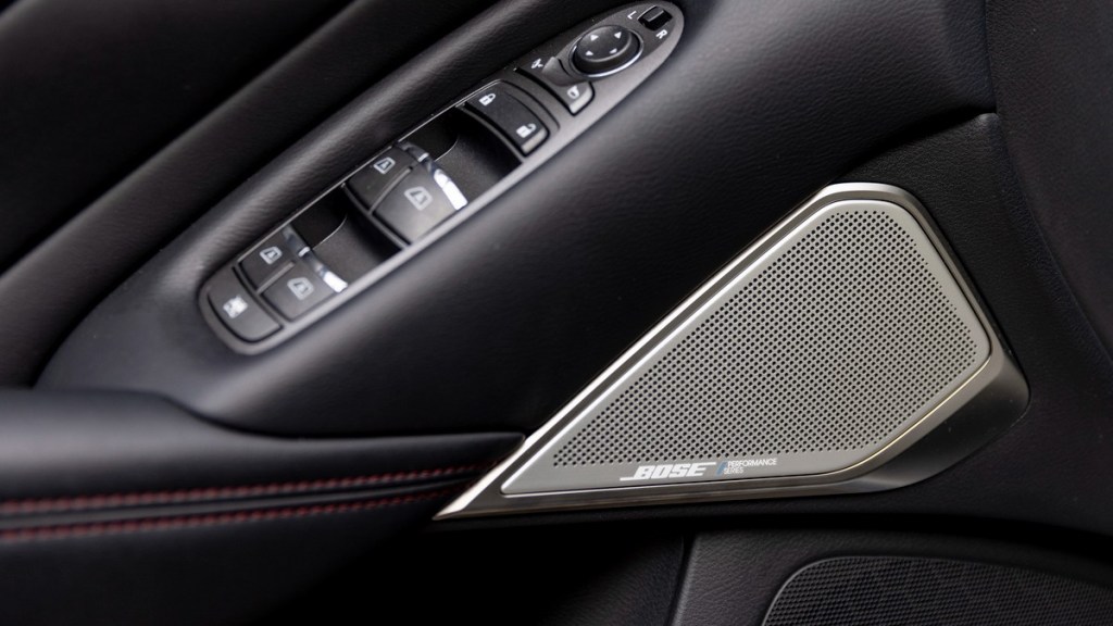 one of the bose performance series speakers found on the interior of a new infiniti q50 red sport 400 awd