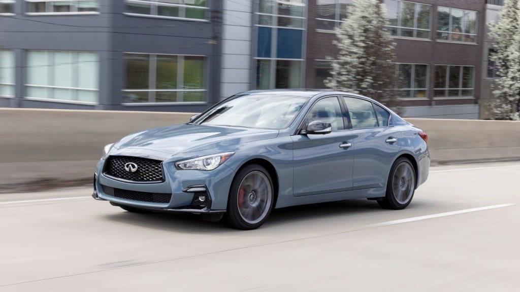the new 2022 infiniti q50 red sport 400 awd, a stunning new luxury sedan, driving on the highway