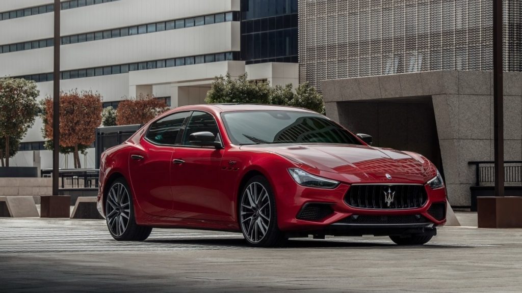 a sleek and luxurious 2022 maserati trofeo sits in a city center on display
