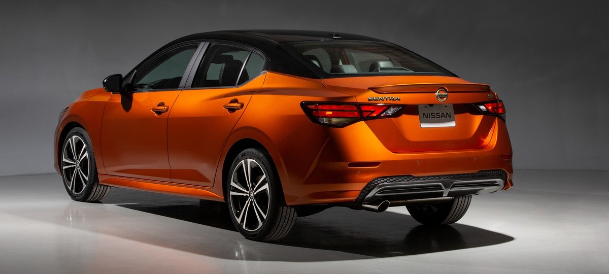 an orange 2022 Nissan Sentra parked under lights