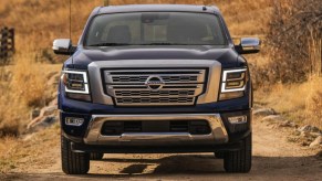 A blue 2022 Nissan Titan pickup truck is parked.