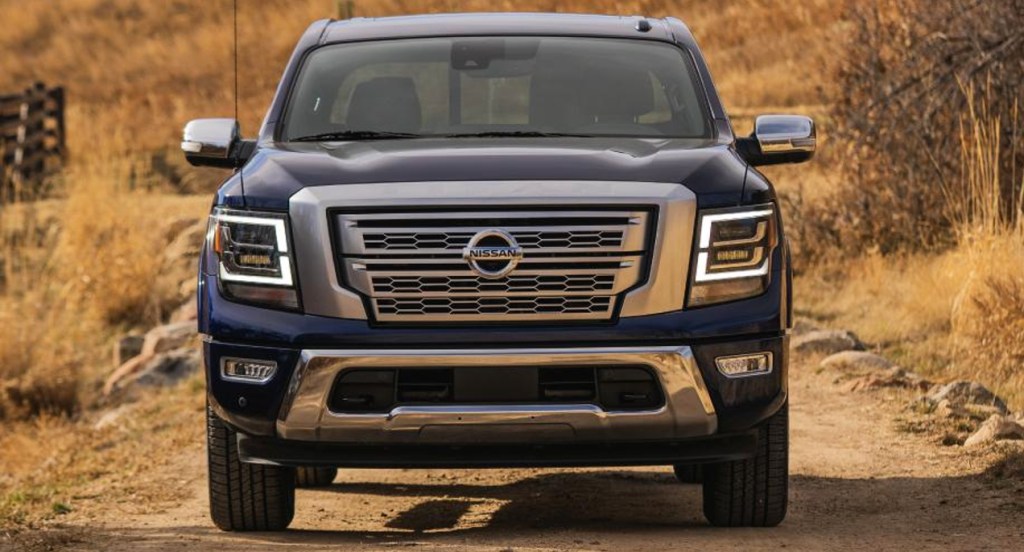 A blue 2022 Nissan Titan full-size pickup truck is parked. 