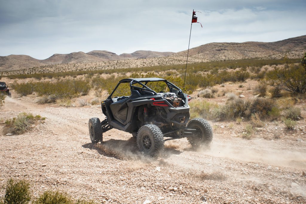 2022 Polaris RZR Pro R driving through the desert rear view