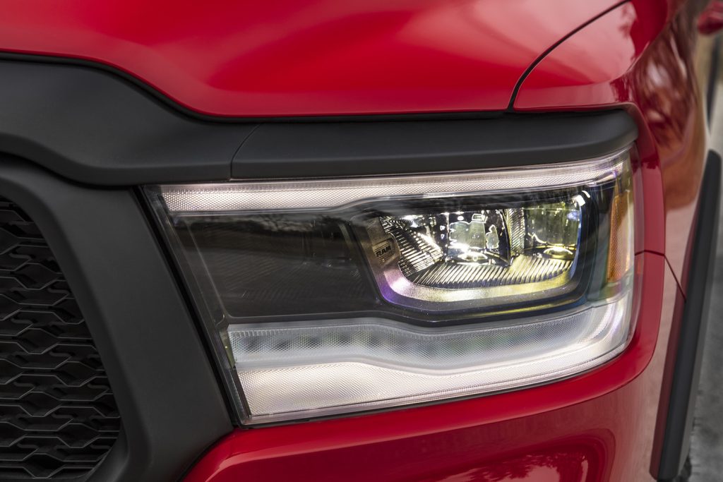 The headlight of a special edition Ram 1500 pickup truck.