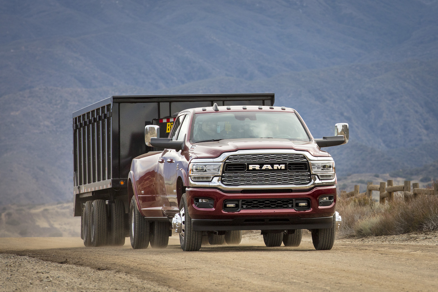 Ram 3500 heavy-duty truck towing a trailer through the desert.