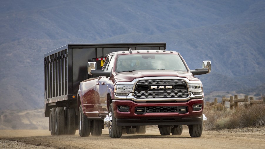 Ram 3500 heavy-duty truck towing a trailer through the desert.
