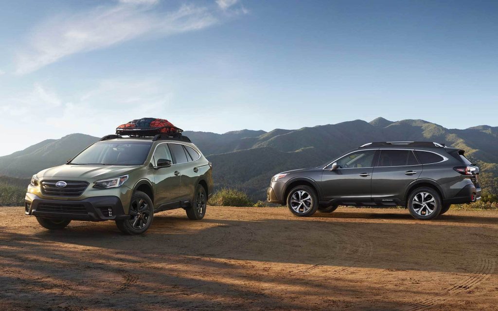 A pair of 2022 Subaru Outback models parked together. consumer reports best midsize suv is also the cheapest.