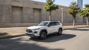 2022 Toyota RAV4 Off Road in white driving on a road