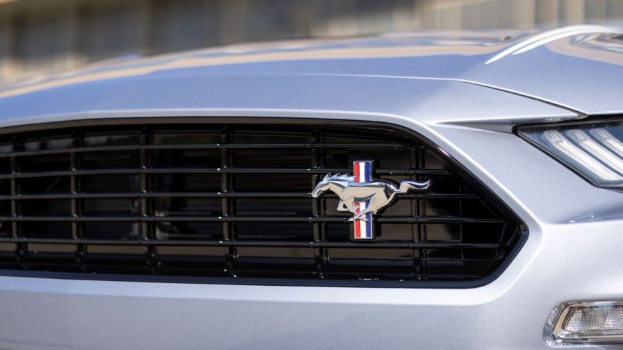 Close-up view of a silver 2022 Ford Mustang grille