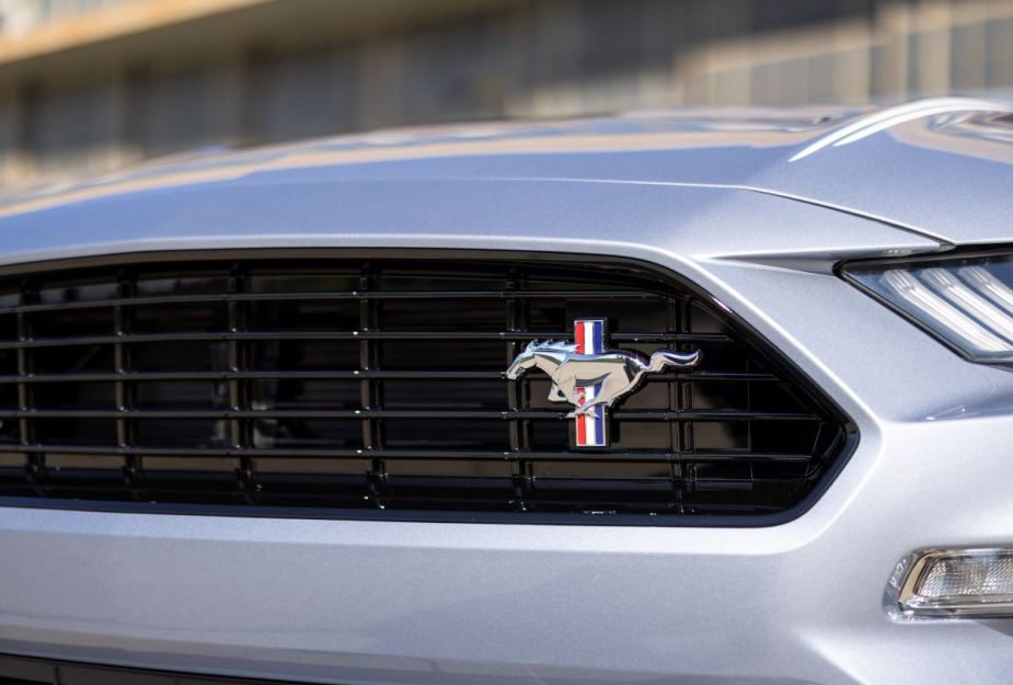 Close-up view of a silver 2022 Ford Mustang grille