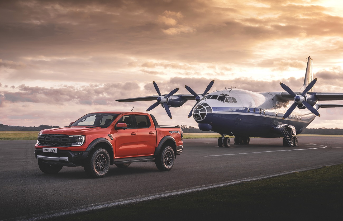 a red 2023 Ford Ranger Raptor on a runway