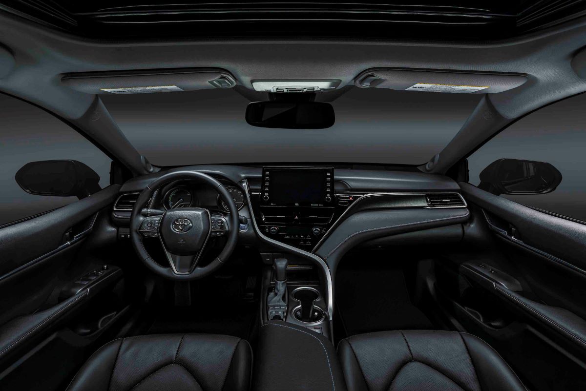 Interior shot of an all-black 2022 Toyota Camry XSE Hybrid sedan