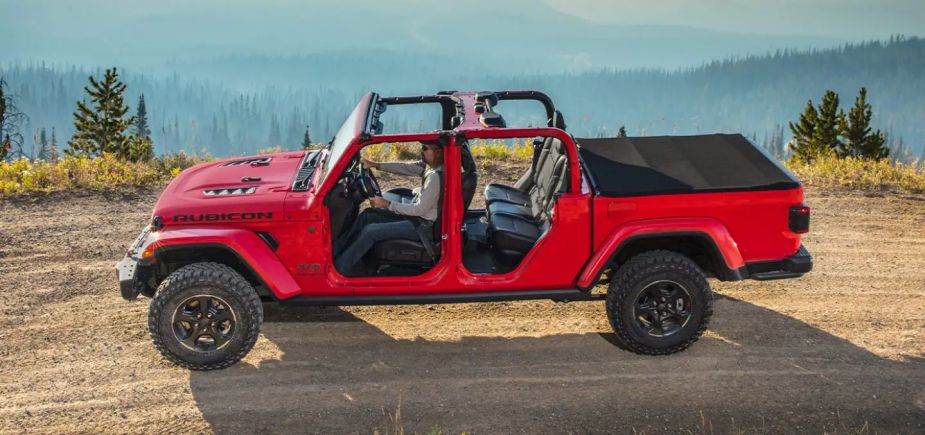A red 2022 Jeep Gladiator is featured with its doors off. This is a fairly unique feature for a mid-size truck.