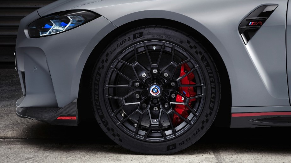 the black forged alloy wheels and red brakes available on the 2023 BMW M4 CSL