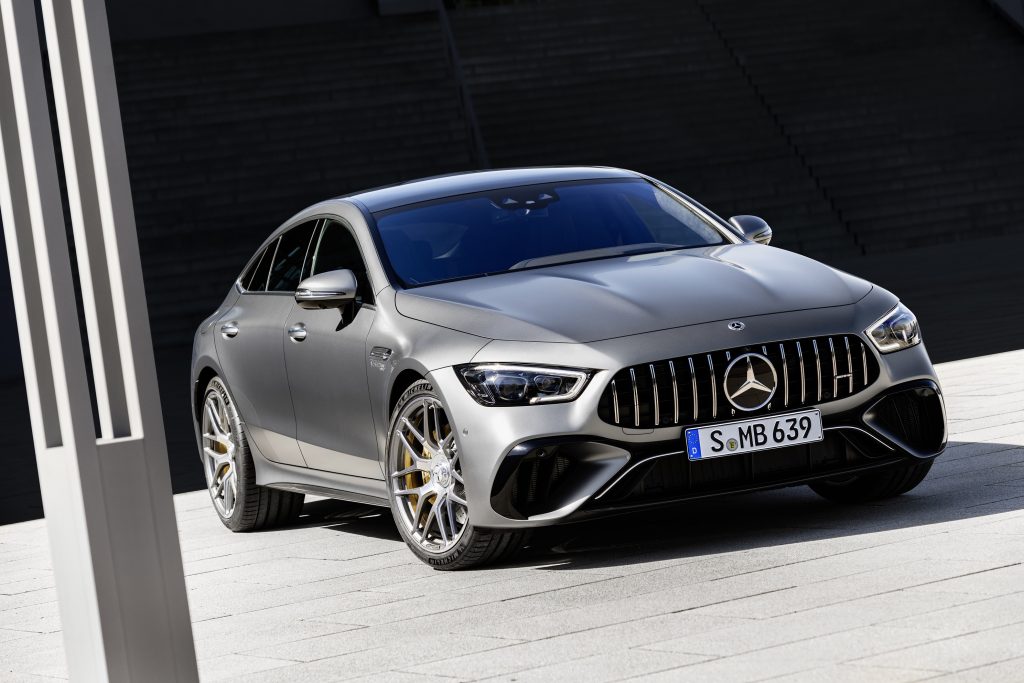 A matte-gray 2023 Mercedes-AMG GT 63 S by an office building