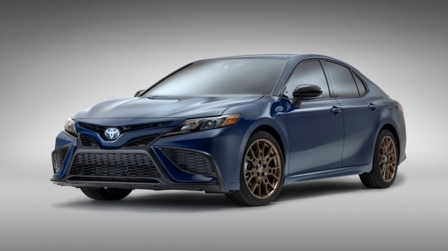 The 2023 Toyota Camry SE Nightshade Special Edition midsize sedan in Reservoir Blue, a new exterior color
