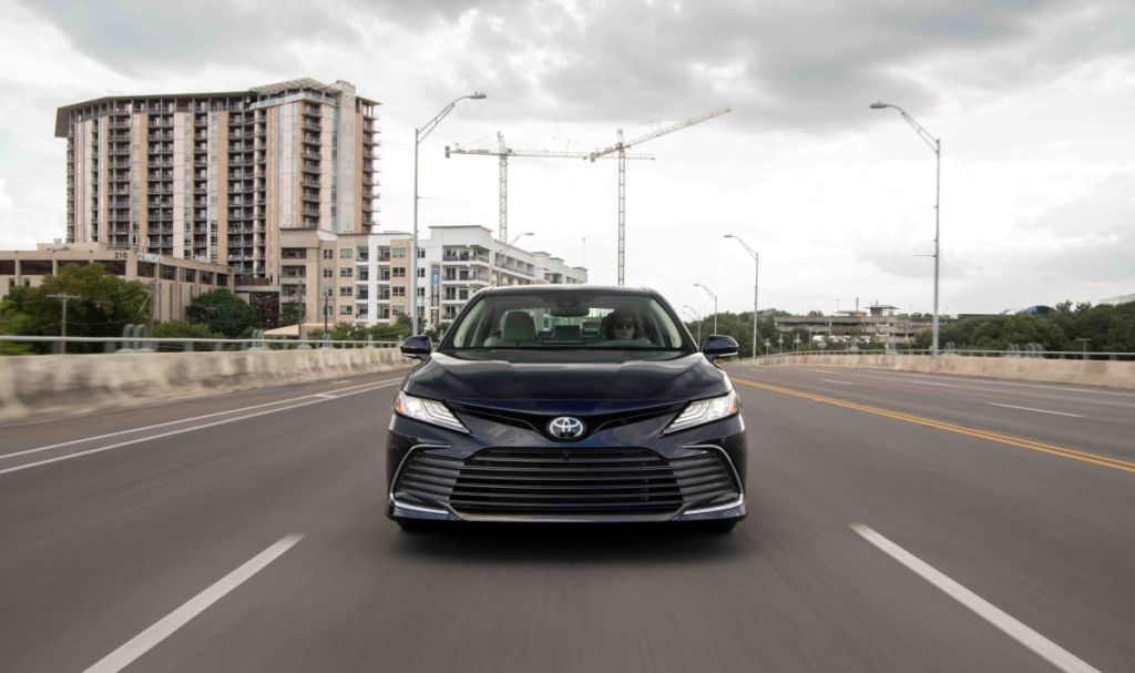 Frontal view of a black 2022 Toyota Camry midsize sedan; the style is sharp, but a 2023 redesign could make the Camry even more competitive