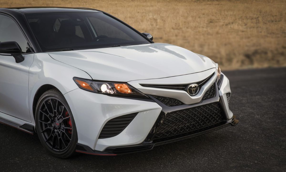 Front of a white 2023 Toyota Camry TRD sports sedan