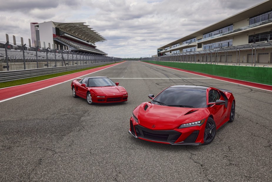A red 2022 Acura NSX Type S in front of a classic red NSX on a racetrack