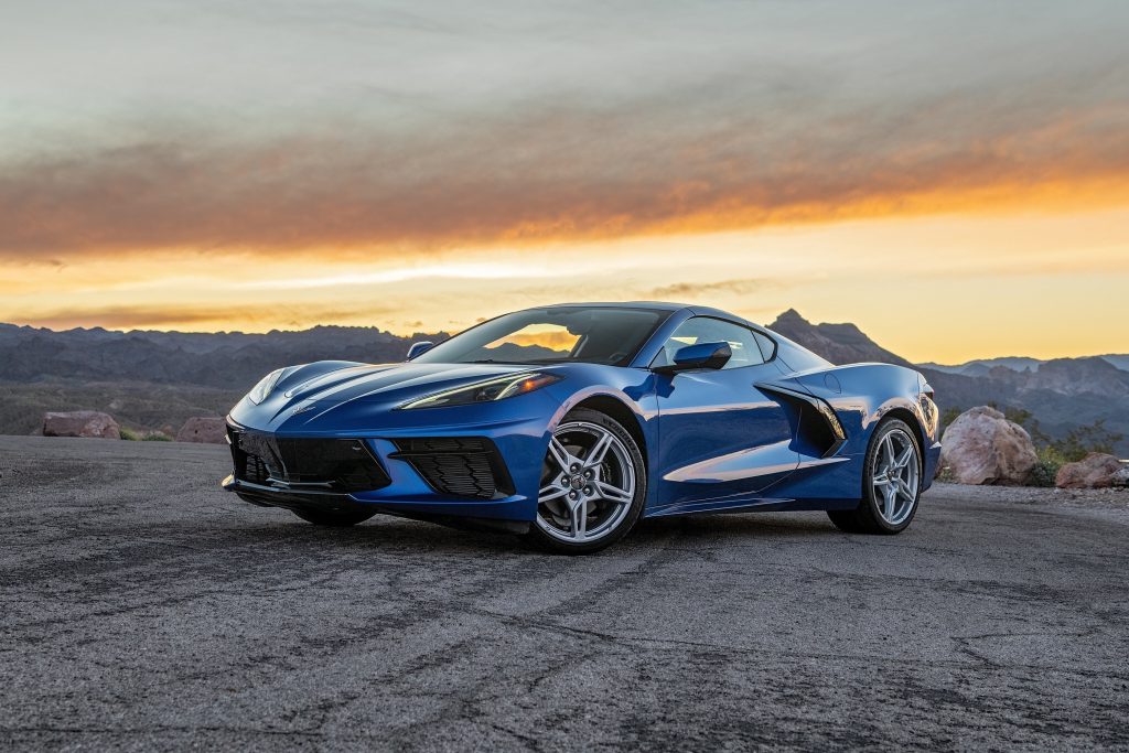 A blue 2022 Chevrolet C8 Corvette Stingray on a desert canyon looking out over