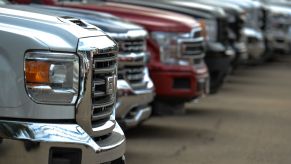 A line of trucks in various colors.