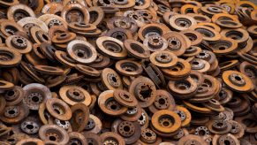A pile of removed rusty brake rotors
