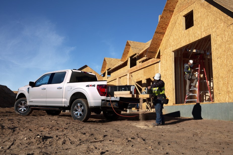 A white F-150 with workers using the Pro Power Onboard