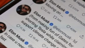 An illustration of Elon Musk tweets circa April 25, 2022 on a smartphone