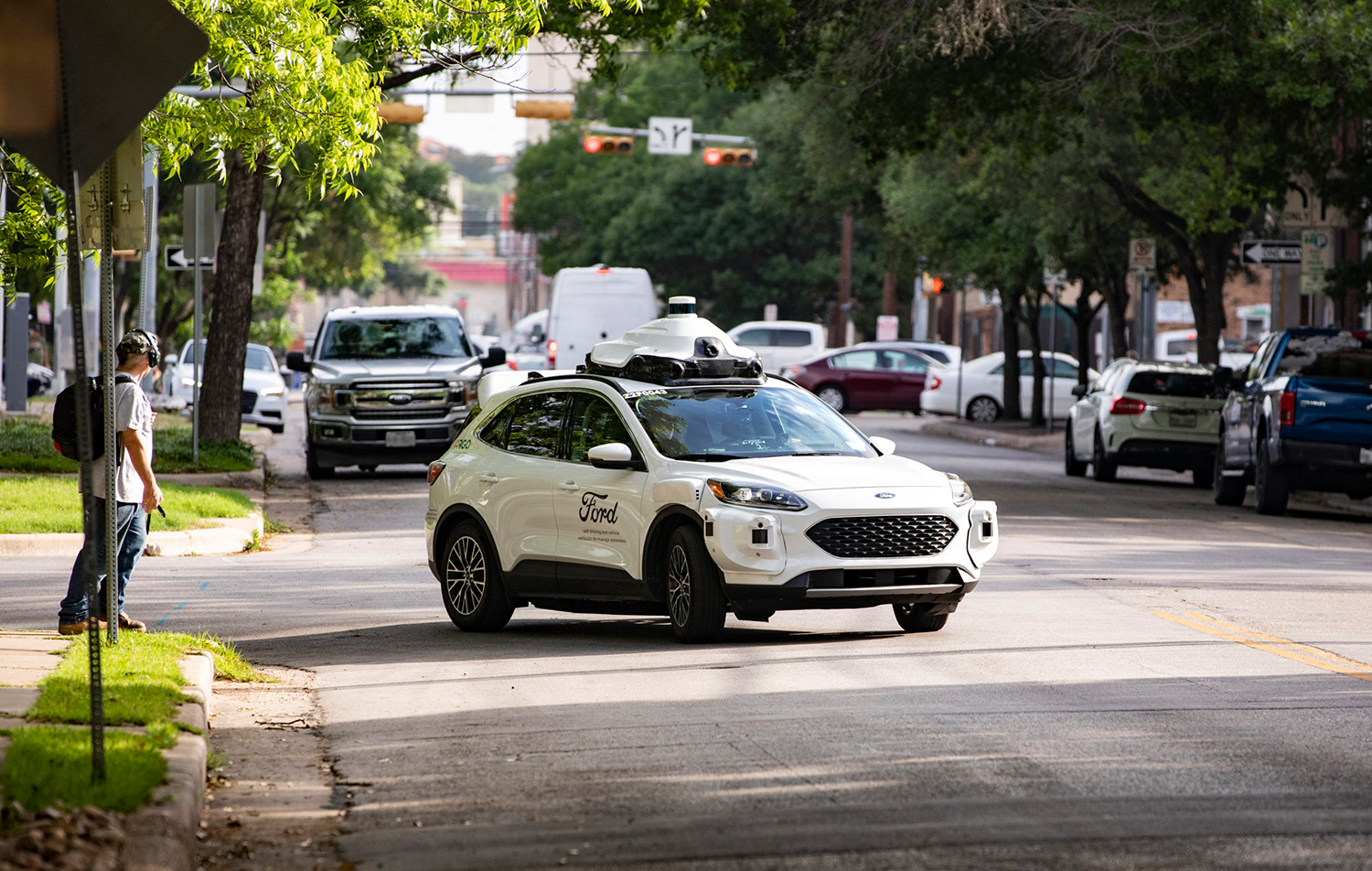 A fully autonomous Argo AI taxi and Ford Escape delivery on public roads in Austin, Texas