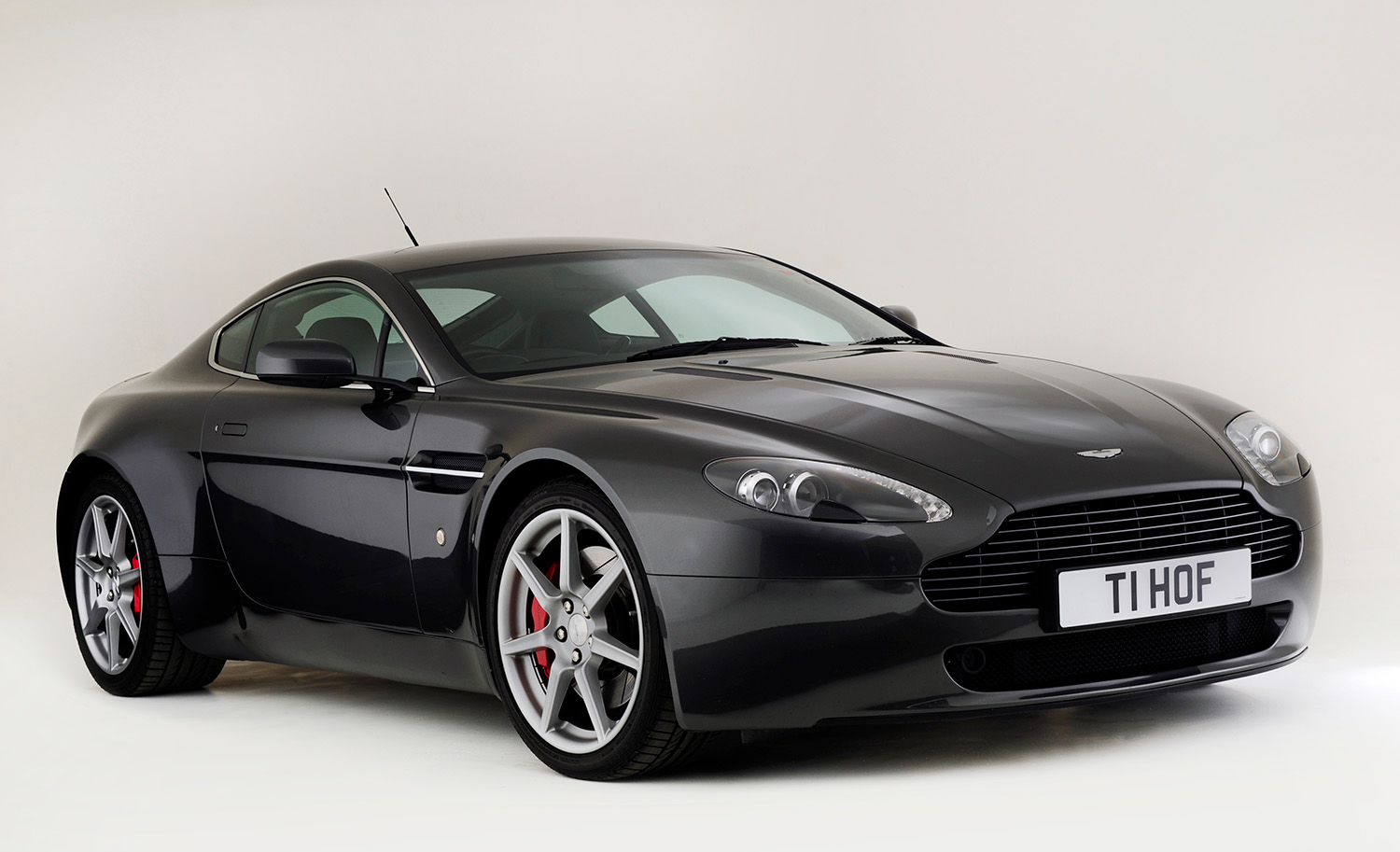 Silver Aston Martin V8 Vantage, one of the most attainable supecars and/or exotic cars in the world