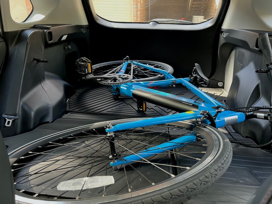 A view of an e-bike sitting in the rear cargo area of the RAV4