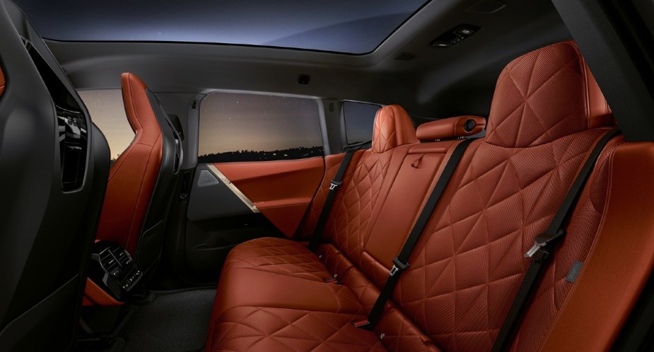 The interior of a red 2022 BMW iX electric SUV. 