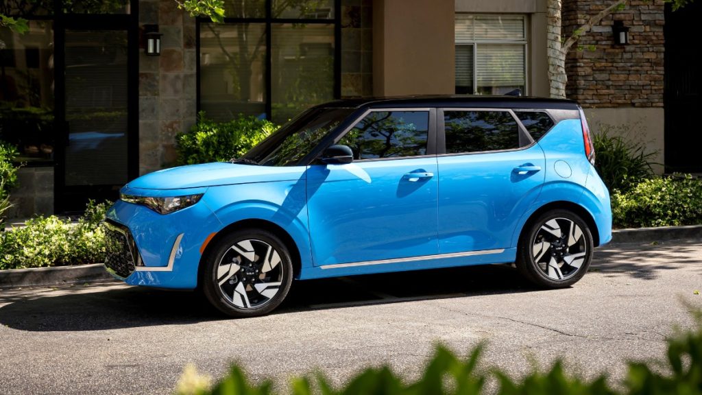 Blue 2023 Kia Soul parked on a street, highlighting its release date and price