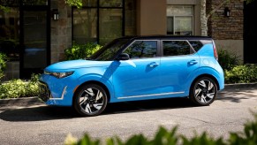 Blue 2023 Kia Soul parked on a street, highlighting its release date and price