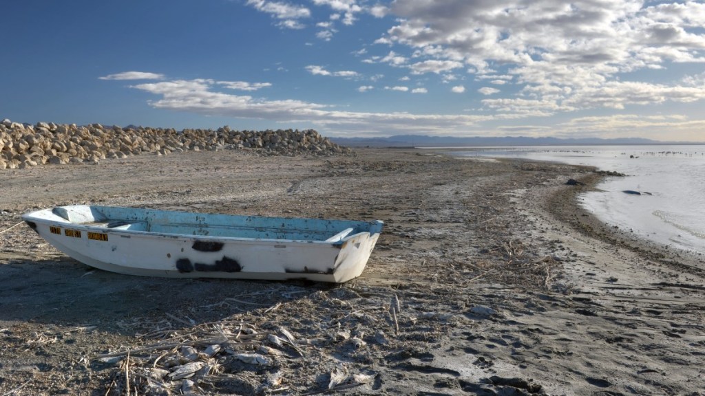 Boat in toxic lake bed of Salton Sea in California, which has lithium to power EVs and reduce dependency on China