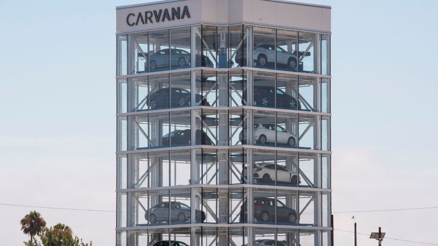 The Carvana building with multiple cars inside.