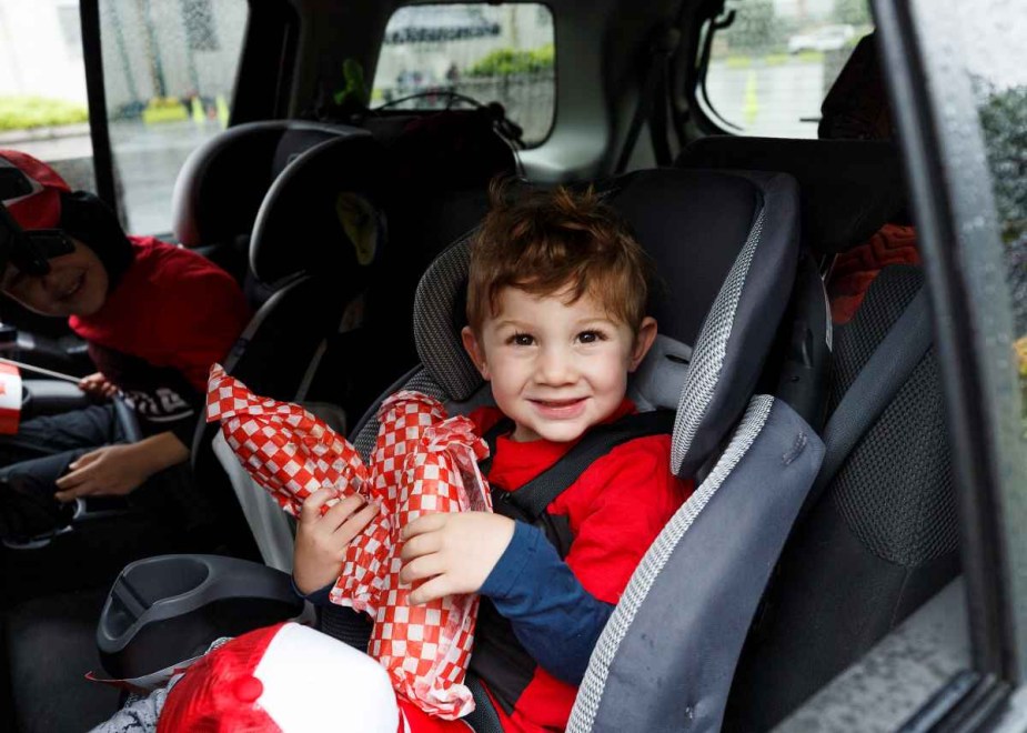 Children sitting in child car seats, highlighting study that shows over half of child car seats have toxic chemicals