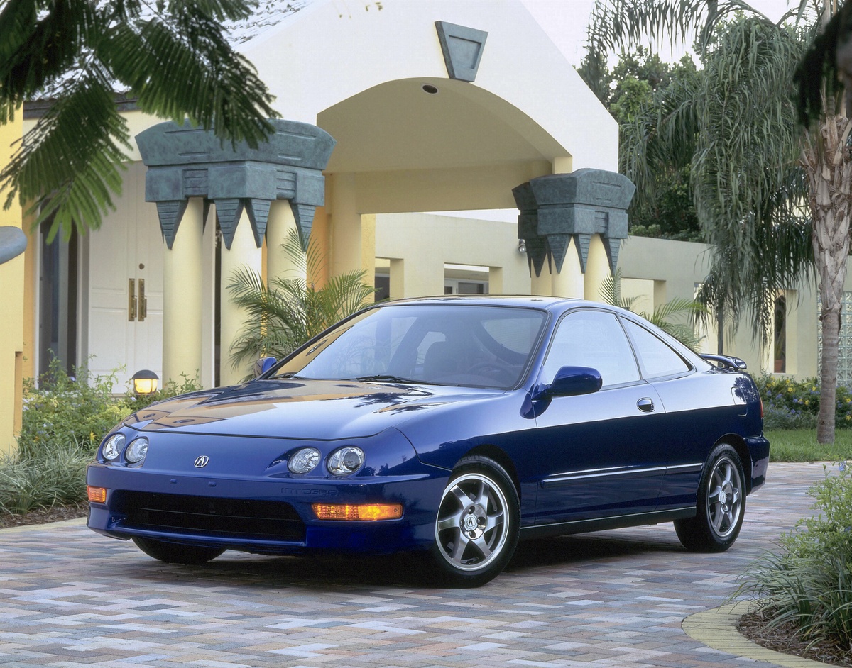 Blue 2001 DC2 Acura Integra GS-R Sport Coupe parked in front of house and palm trees