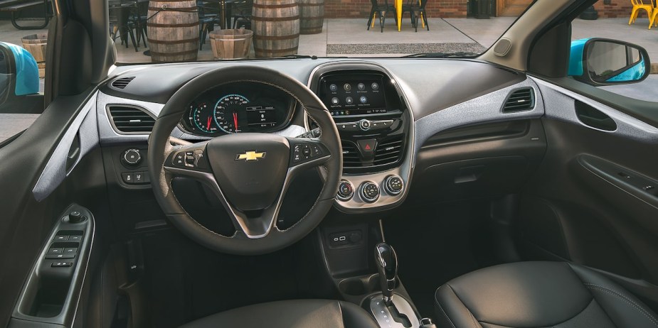 Dashboard and front seats in 2022 Chevy Spark, the only American car that costs less than $15,000