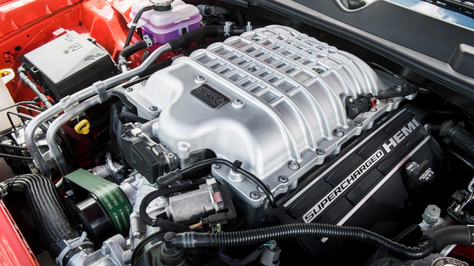 the supercharged hemi engine found in a new dodge charger hellcat, an exciting performance car with a supercharger
