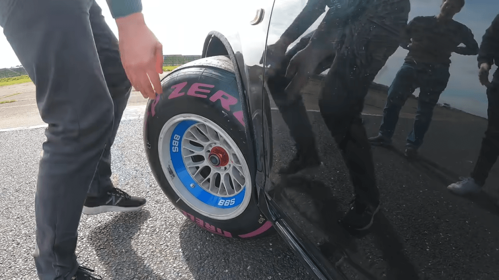 Driven Media crew puts F1 tires onto the Toyota MR2
