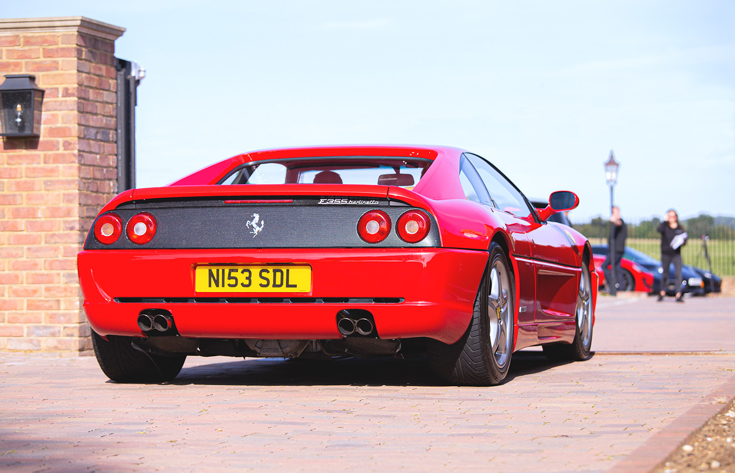 Red Ferrari F355 Berlinetta coupe in England is very similar to the F355 race car that crashed in the neighborhood