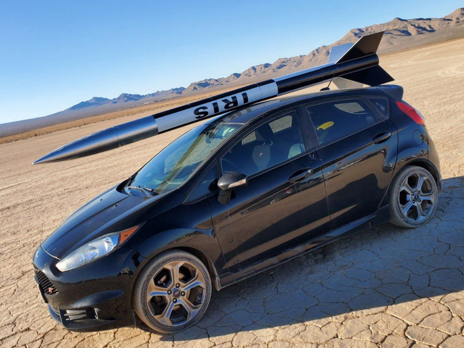 2016 Ford Fiesta ST with a model rocket on top outside of Las Vegas, Nevada