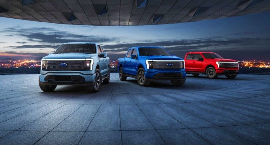 Ford F-150 Lightning electric pickup trucks are lined up. 