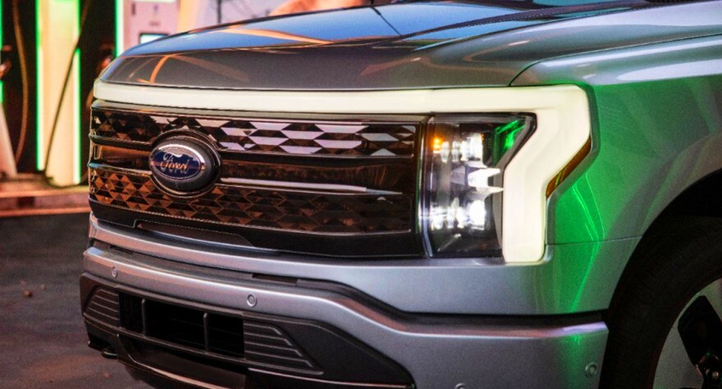 The front of a silver Ford F-150 Lightning electric pickup truck.