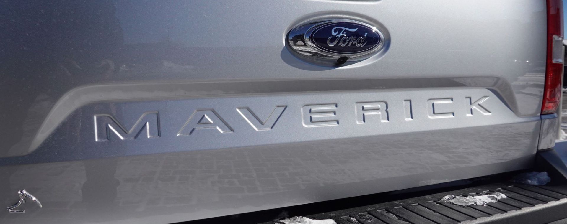 A silver back-end of a Ford Maverick, which is now the new Terminix truck as a Ford Maverick Hybrid.